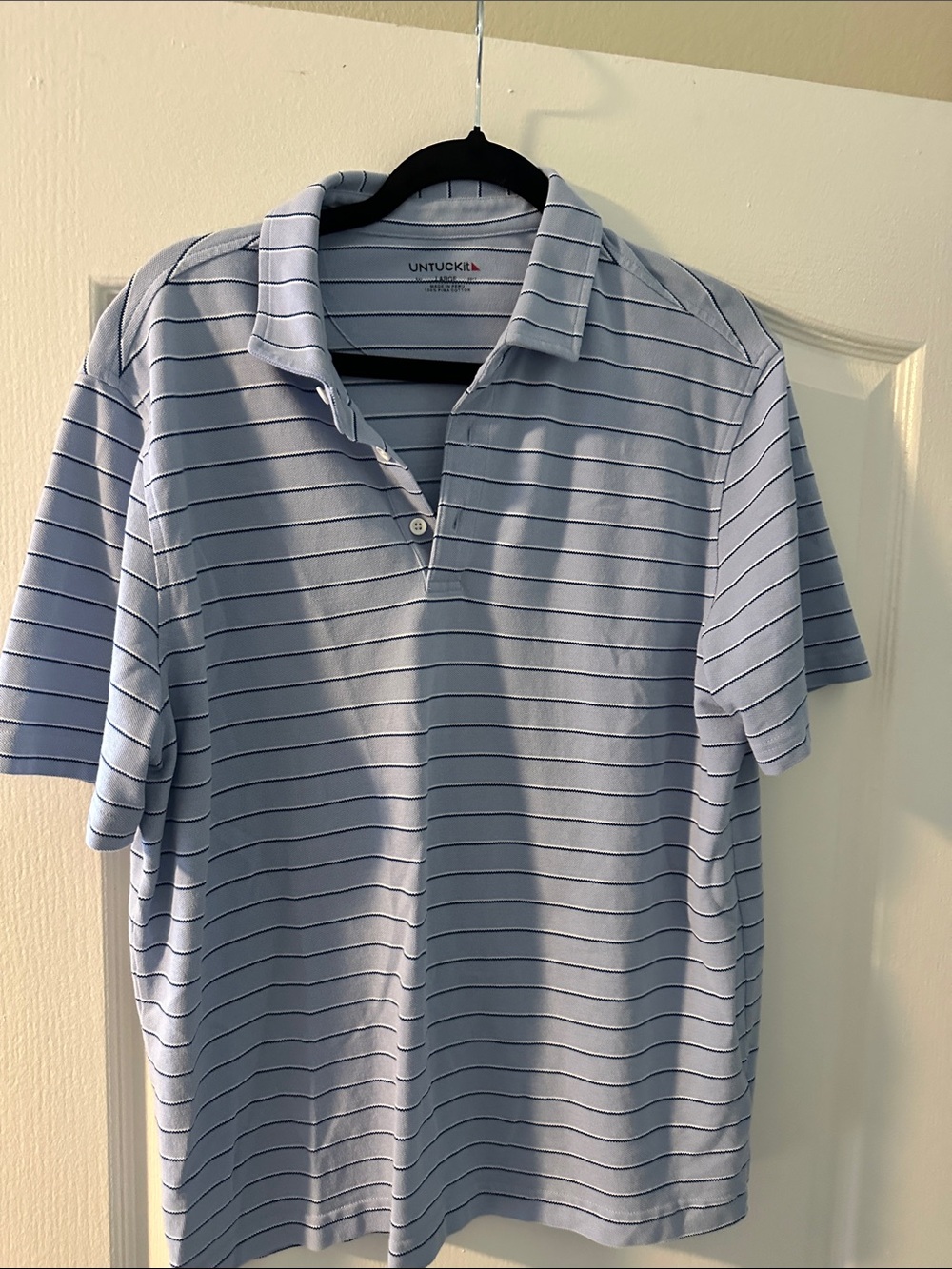 UNTUCKit Men’s Light Blue Polo with Navy Stripes